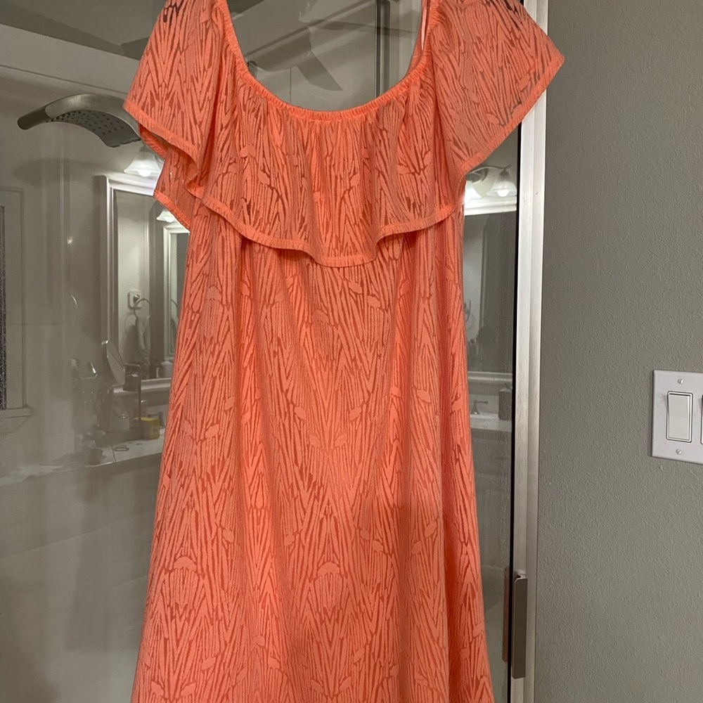 Large comfy dress. Sleeveless with ruffle that covers top of arms. Color orange